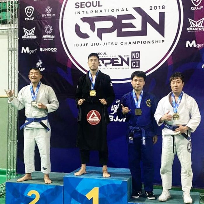 Dave on the Podium of the IBJJF Seoul Open 2018.